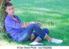 male-model-sitting-next-to-tree-stock-photo_csp13322922.jpg